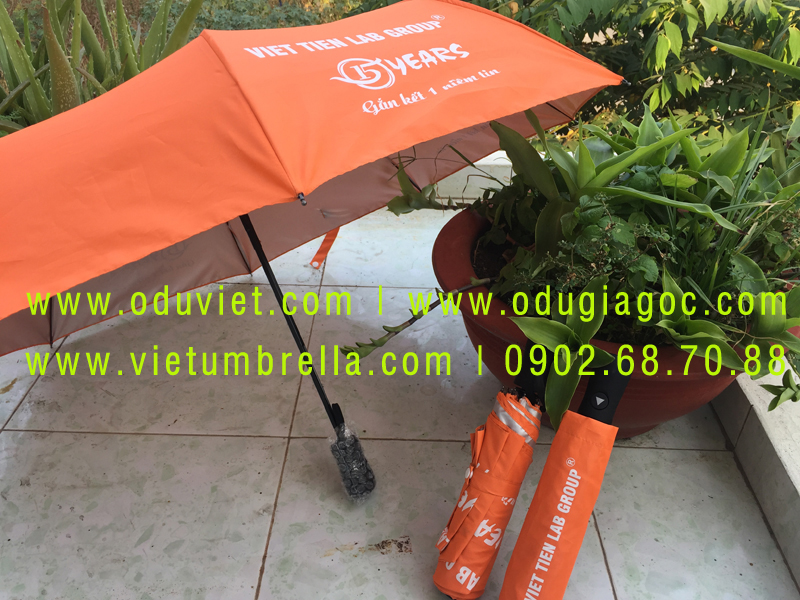 xưởng sản xuất ô dù cầm tay in logo quảng cáo